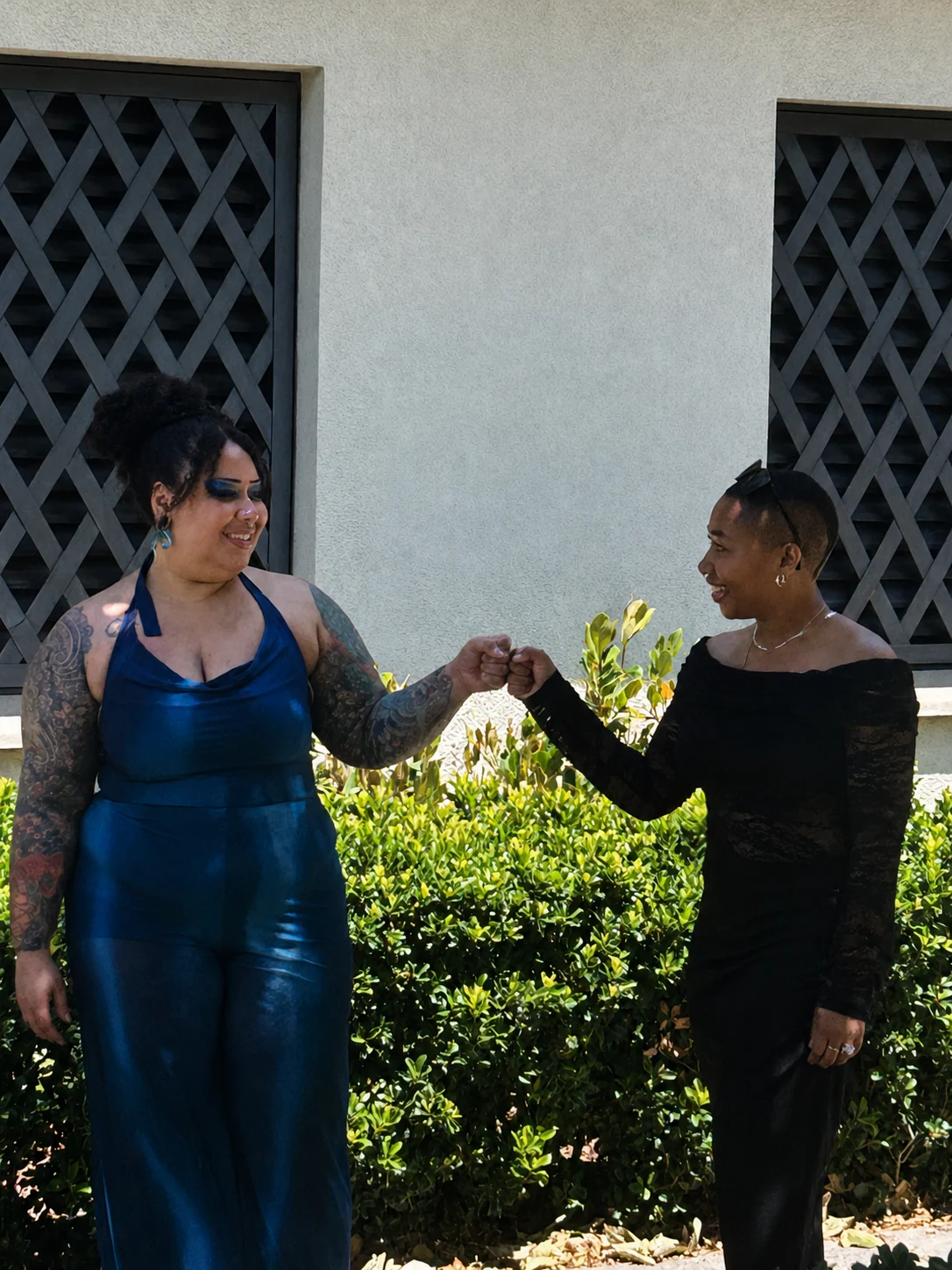 Jade sharing a fist bump with her sister