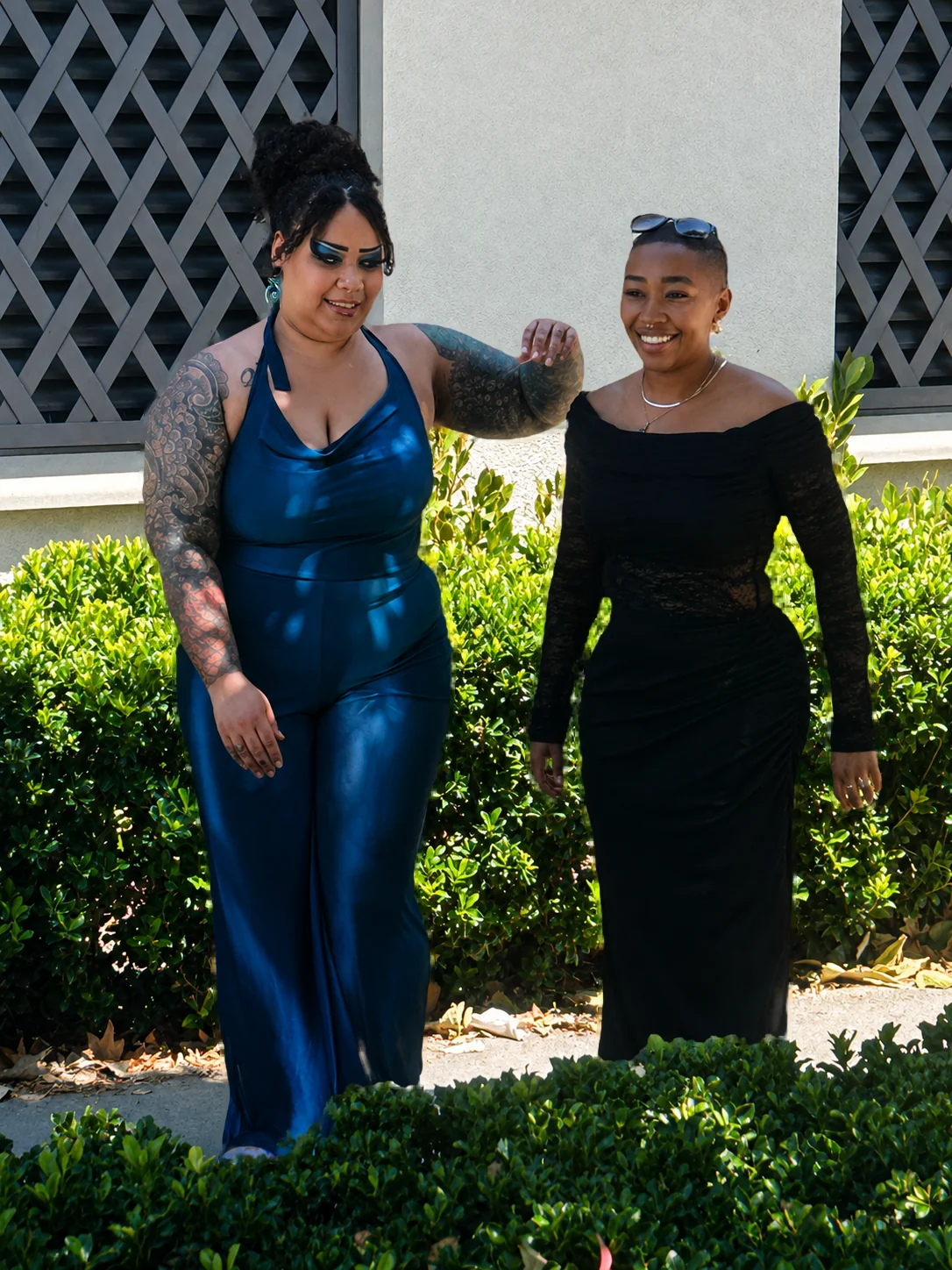 Jade walking arm in arm with her older sister after the wedding
